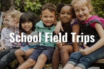 school children hugging and smiling