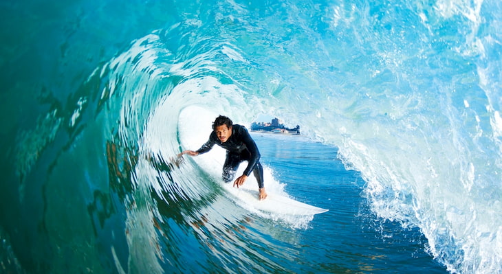 A surfer zooms through a barrel wave near Maverick's Beach in California